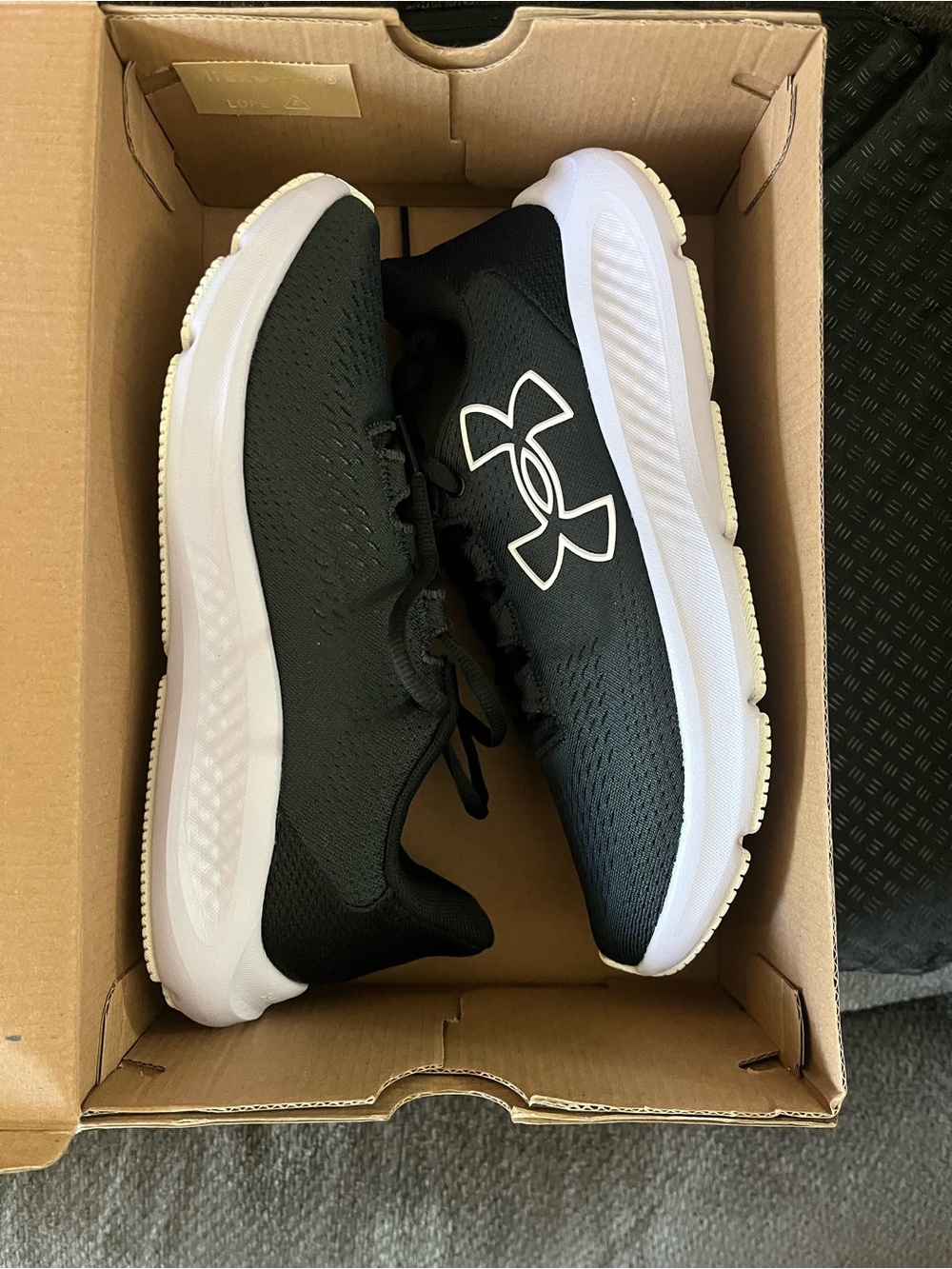 Under Armour women’s Black and light lilac Athletic Sneakers